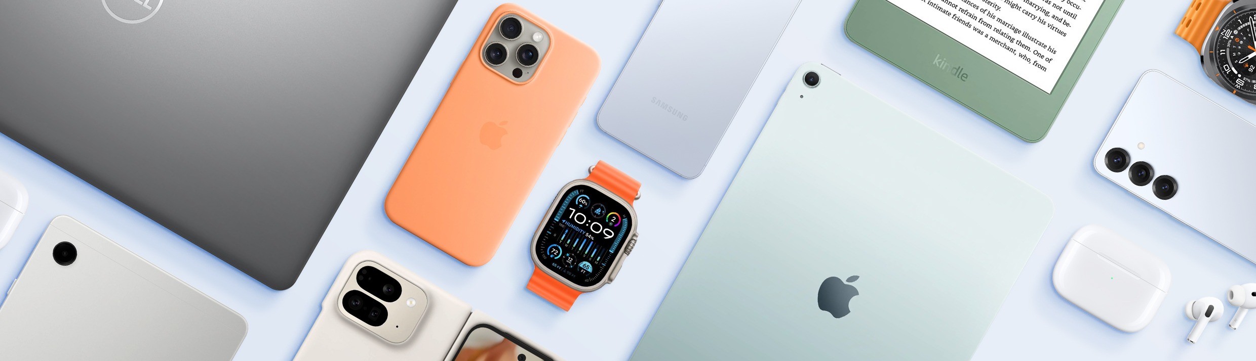 Eine Flatlay von verschiedenen Geräten, wie einem iPad, iPhone, einer Smartwatch, einem Laptop usw.