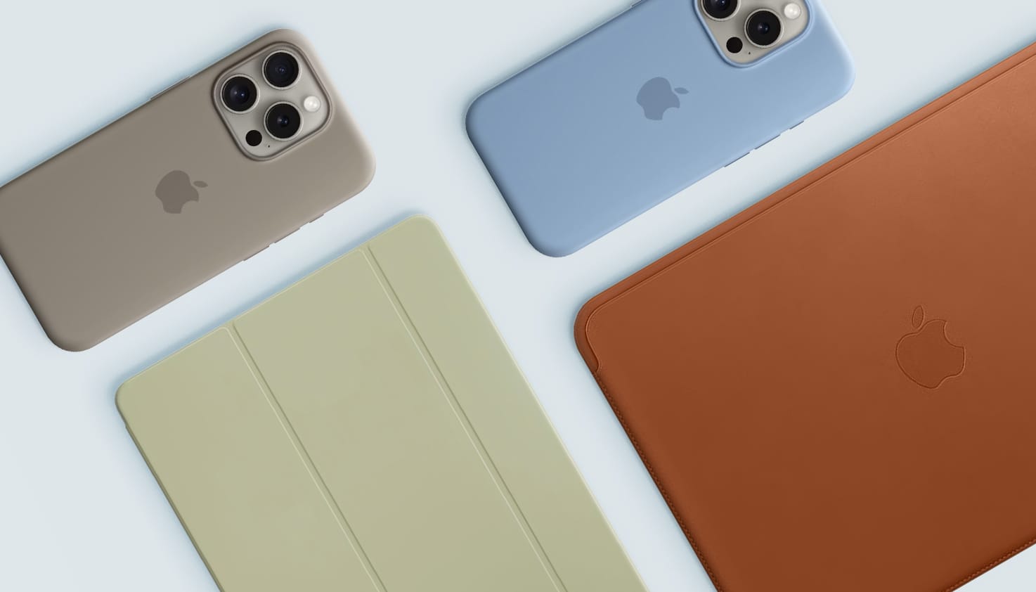 Zu sehen sind Apple iPhones, ein iPad und MacBook mit original Apple Zubehör wie iPhone-Hüllen, einem iPad Cover und einer MacBook Hülle.